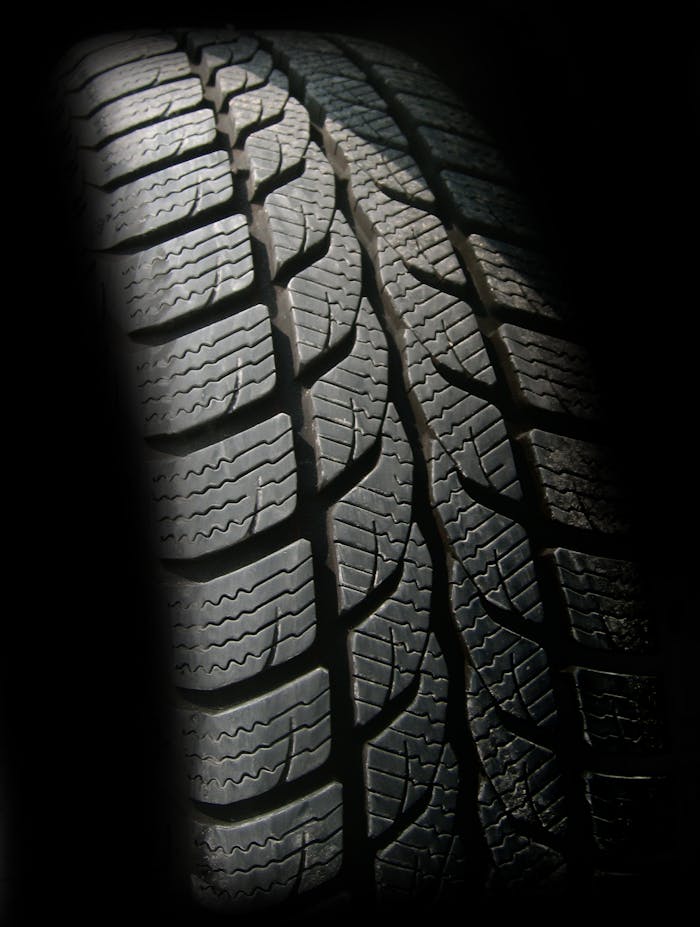our-services-1 Detailed close-up image of a rubber tire showcasing texture and tread pattern, ideal for design concepts.
